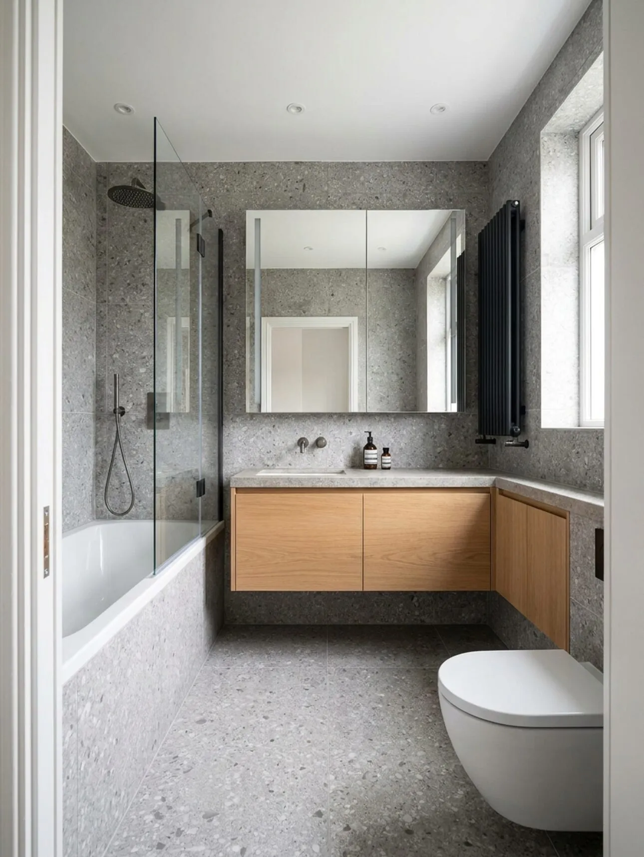 Full view of the grey bathroom from the doorway